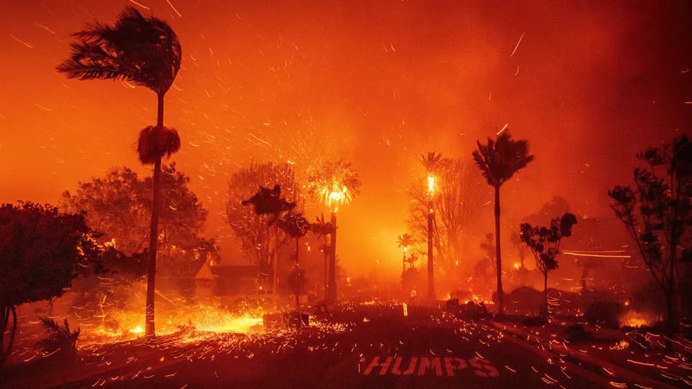 Fire burns through the Pacific Palisades neighborhood of Los Angeles, Jan. 7, 2025. (AP Photo/Ethan Swope)